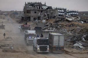 Humanitarian aid trucks entering Gaza Strip through the Kerem Shalom crossing from Egypt on January 22, 2025, after a ceasefire agreement